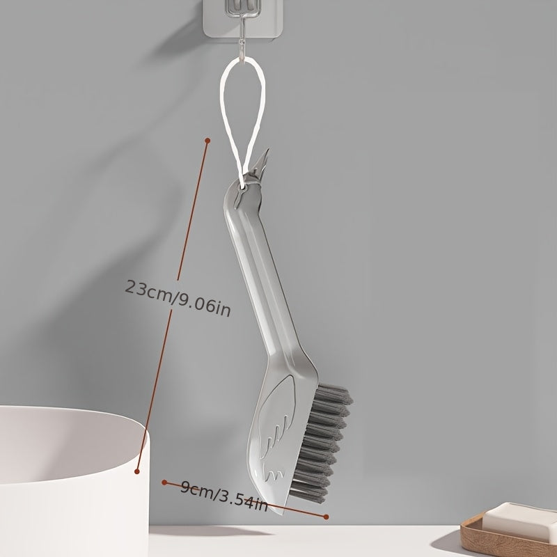 A Multifunctional Gap Cleaning Brush in a Cartoon Swan Design, Featuring a Head on The Handle That Can Be Used As a Spatula to Remove Stubborn Stains. It'S Suitable for Cleaning Stains in The Corners of Kitchens, Bathrooms, And Furniture