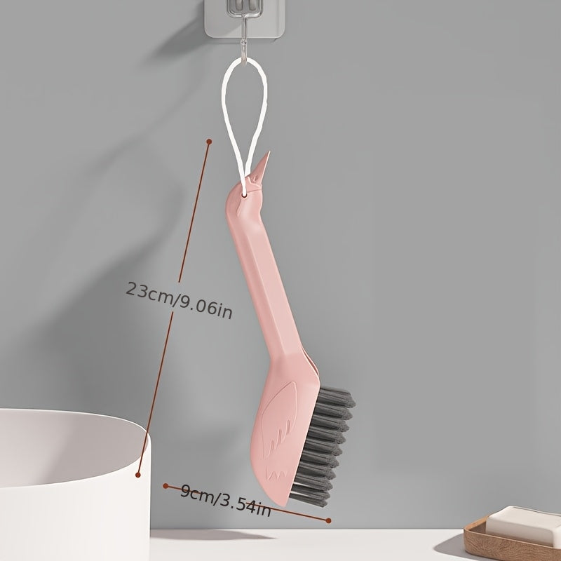 A Multifunctional Gap Cleaning Brush in a Cartoon Swan Design, Featuring a Head on The Handle That Can Be Used As a Spatula to Remove Stubborn Stains. It'S Suitable for Cleaning Stains in The Corners of Kitchens, Bathrooms, And Furniture