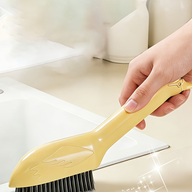 A Multifunctional Gap Cleaning Brush in a Cartoon Swan Design, Featuring a Head on The Handle That Can Be Used As a Spatula to Remove Stubborn Stains. It'S Suitable for Cleaning Stains in The Corners of Kitchens, Bathrooms, And Furniture
